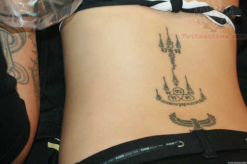 Thai And Eagle Tattoo On Lowerback